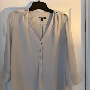 Taupe blouse with brass button detail. Size M